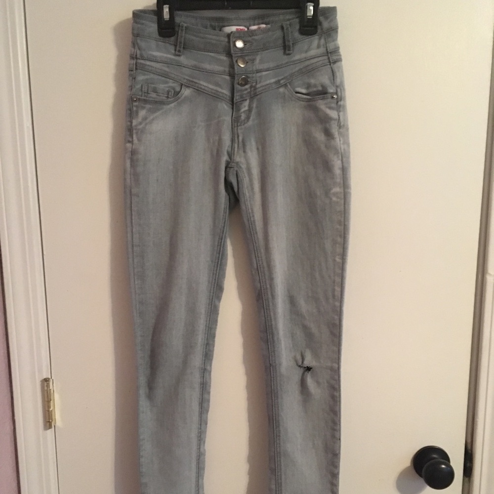 A soft, stretchy, piece with layered button style.